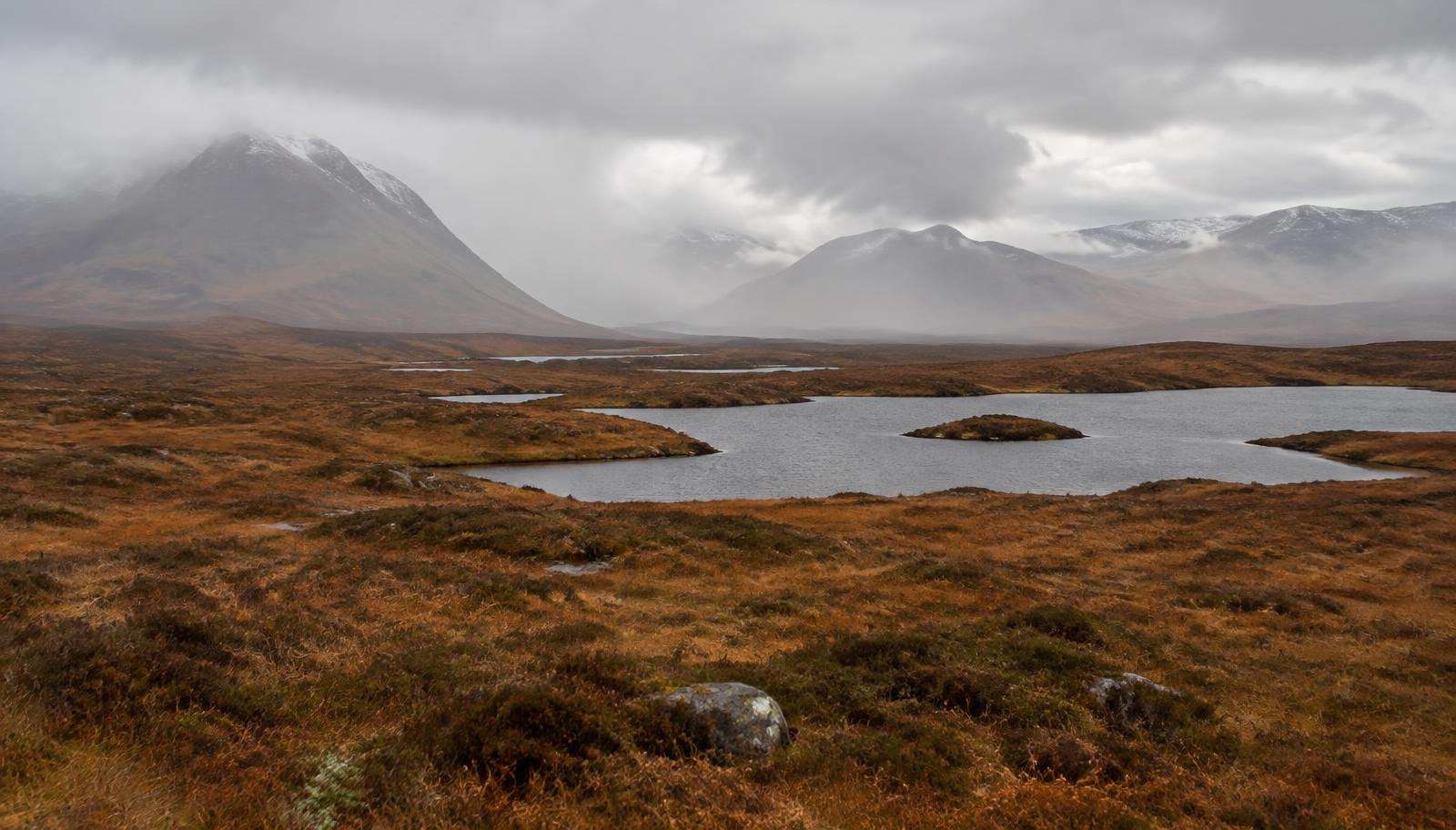 Lochans across Rannoch Moor with misty Highland mountains